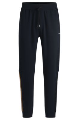 Hugo Boss Cotton-terry Tracksuit Bottoms With Tape Inserts In Dark Blue