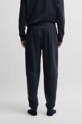 Cotton-terry tracksuit bottoms with tape inserts, Dark Blue