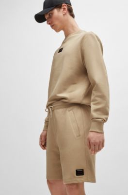 Cotton-terry relaxed-fit shorts with logo trim, Light Beige