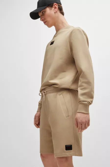 Cotton-terry relaxed-fit shorts with logo trim