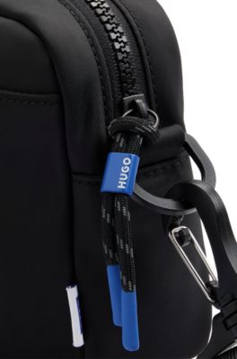 Crossbody bag with smiley-face logo patch, Black