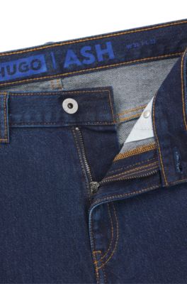 Jeans slim fit de denim el&aacute;stico en azul oscuro, Azul