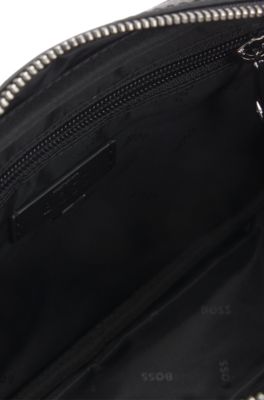 Faux-leather washbag with monogram-print front pocket, Black