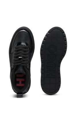 Platform-sole lace-up trainers with patent details, Black