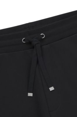 Pantalones de ch&aacute;ndal en felpa de algod&oacute;n con logo ahumado, Negro