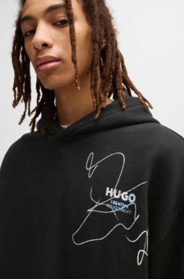 Sudadera holgada de felpa de algod&oacute;n con capucha y logo garabateado, Negro