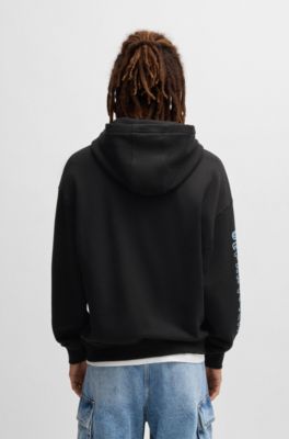 Sudadera holgada de felpa de algod&oacute;n con capucha y logo garabateado, Negro