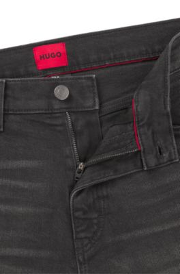 Jeans slim fit de denim el&aacute;stico negro, Negro