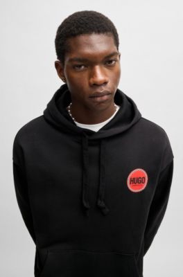 Sudadera con capucha relaxed fit en felpa de algod&oacute;n con logos estampados, Negro