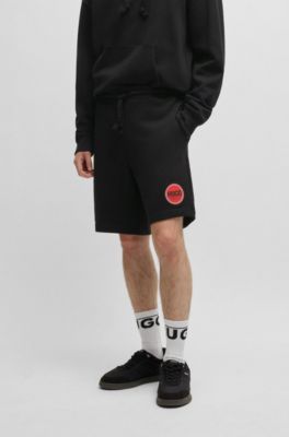 Shorts relaxed fit de felpa de algod&oacute;n con logo estampado, Negro