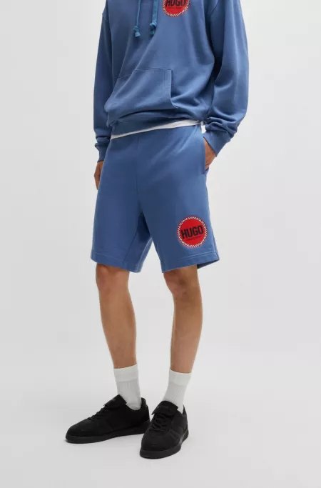 Cotton-terry relaxed-fit shorts with logo print