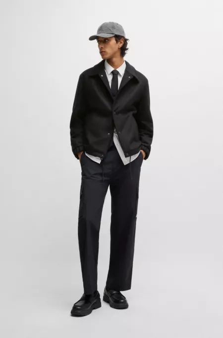 Wool coach jacket with adjustable hem