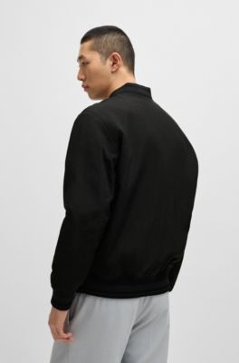 Veste d&eacute;perlante avec logo en gomme, Noir