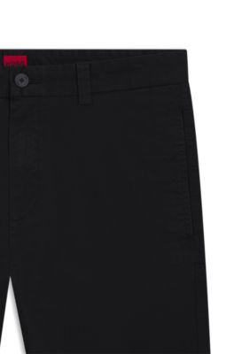 Pantalones slim fit en tejido de gabardina de algod&oacute;n el&aacute;stico, Negro