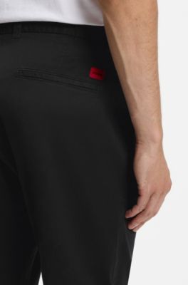 Pantalones slim fit en tejido de gabardina de algod&oacute;n el&aacute;stico, Negro