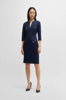 V-neck dress with zipped pockets and cropped sleeves