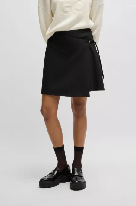 Wrap mini skirt with branded belt buckle