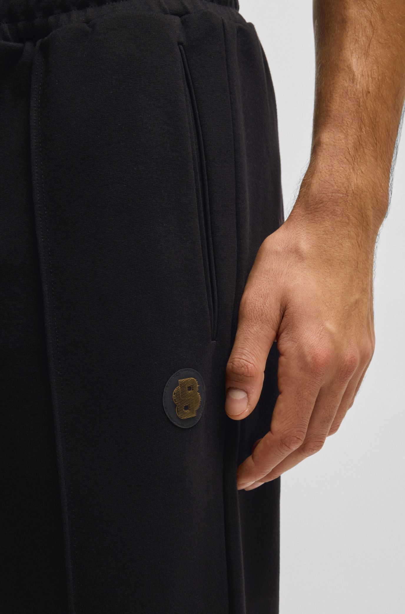 BOSS - Cotton tracksuit bottoms with Double B monogram - Black