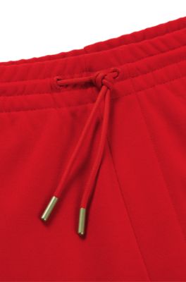 Tracksuit bottoms with checked tape, Red