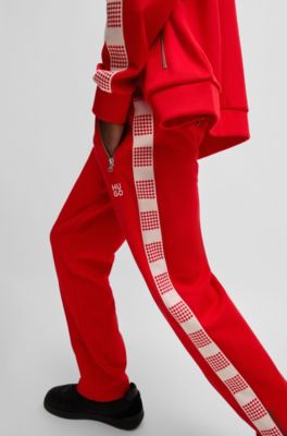 Tracksuit bottoms with checked tape, Red
