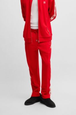 Tracksuit bottoms with checked tape, Red