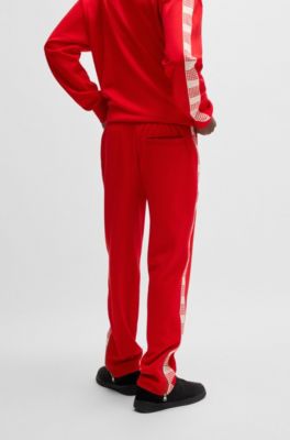 Tracksuit bottoms with checked tape, Red