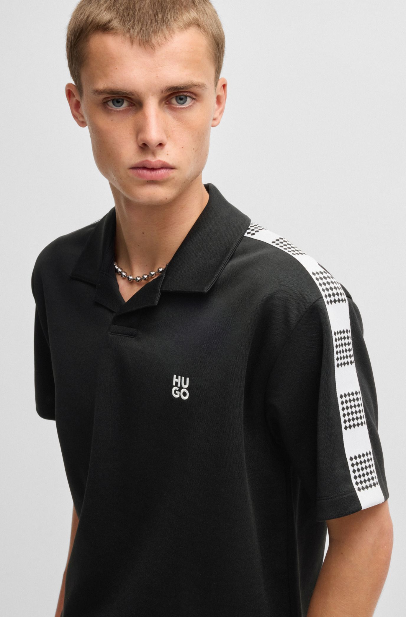 HUGO - Checked-tape polo shirt in a cotton blend - Black