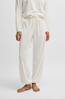 Bas de surv&ecirc;tement en coton m&eacute;lang&eacute; avec &eacute;tiquette logot&eacute;e rouge, Blanc