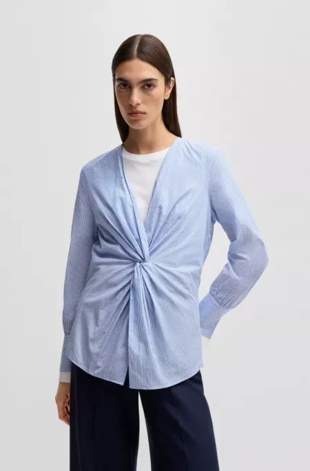 Twist-front slim-fit blouse in striped cotton
