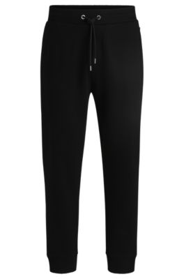 Mercerized-cotton tracksuit bottoms with stripe waistband, Black