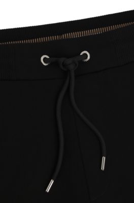 Mercerized-cotton tracksuit bottoms with stripe waistband, Black