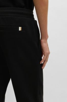 Mercerized-cotton tracksuit bottoms with stripe waistband, Black