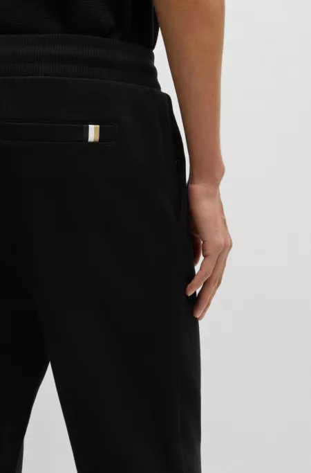 Mercerized-cotton tracksuit bottoms with stripe waistband