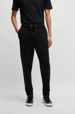 Mercerized-cotton tracksuit bottoms with stripe waistband, Black