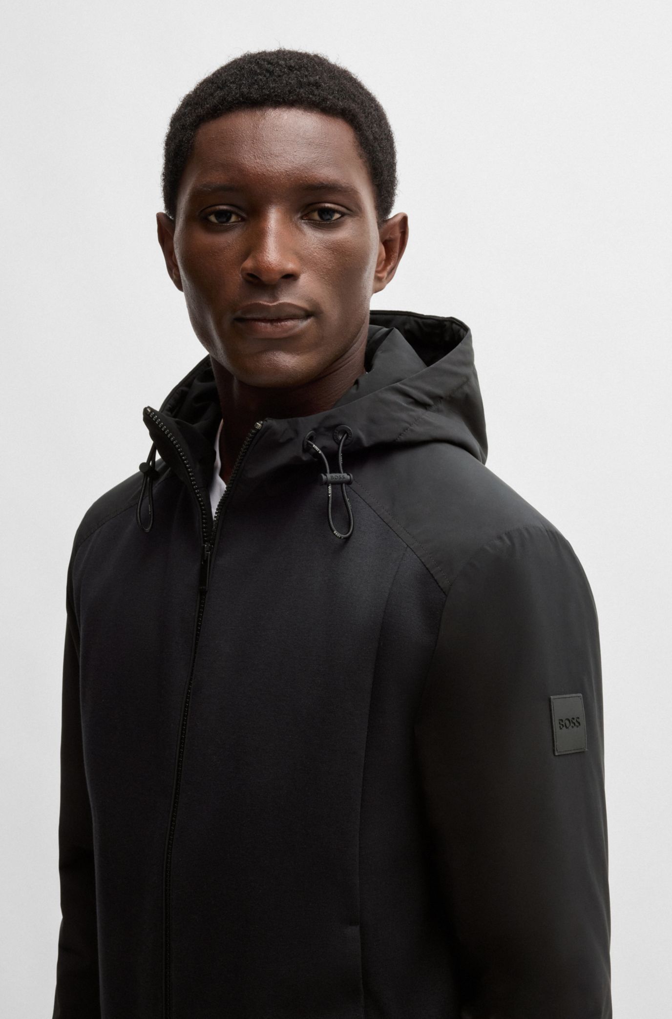 BOSS - Hooded regular-fit jacket in mixed materials - Black