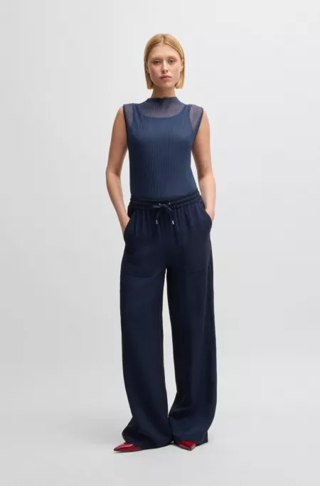 Sleeveless plissé-pleated top