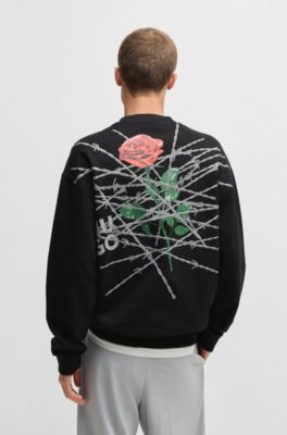 Sudadera relaxed fit de felpa de algod&oacute;n con estampados de temporada, Negro