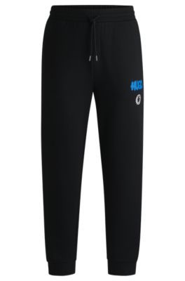 Hugo Boss Cotton-terry Tracksuit Bottoms With Smiley-face Logo In Black
