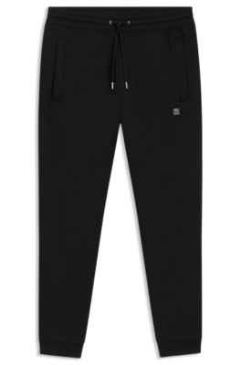 Stacked-logo tracksuit bottoms in a cotton blend, Black