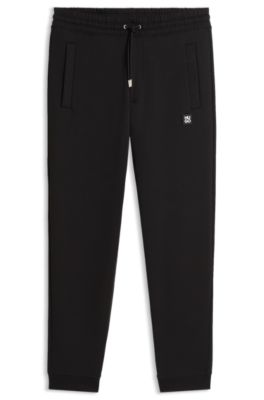 Stacked-logo tracksuit bottoms in a cotton blend, Black