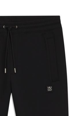 Stacked-logo tracksuit bottoms in a cotton blend, Black
