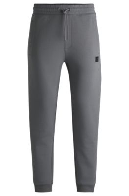 Stacked-logo tracksuit bottoms in a cotton blend, Light Grey