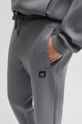 Stacked-logo tracksuit bottoms in a cotton blend, Light Grey