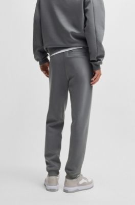 Stacked-logo tracksuit bottoms in a cotton blend, Light Grey
