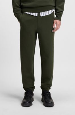 Pantalones de ch&aacute;ndal de algod&oacute;n con logo apilado, Verde oscuro