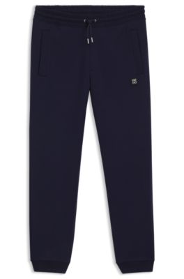 Pantalones de ch&aacute;ndal de algod&oacute;n con logo apilado, Azul oscuro