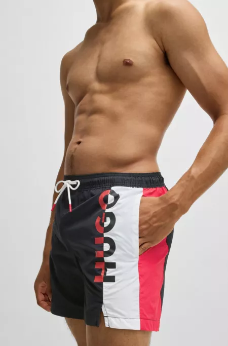 Color-blocked swim shorts with two-tone logo