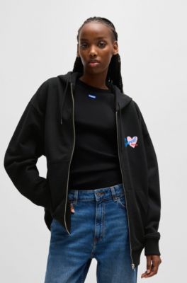 Sudadera de felpa de algod&oacute;n con capucha, cremallera e ilustraci&oacute;n de temporada, Negro