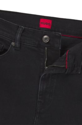 Jeans slim fit de denim el&aacute;stico negro, Negro