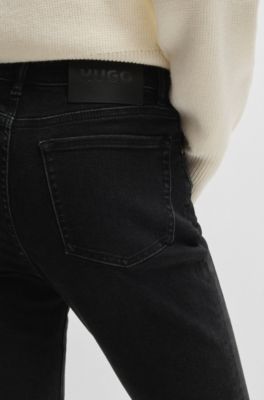 Jeans slim fit de denim el&aacute;stico negro, Negro